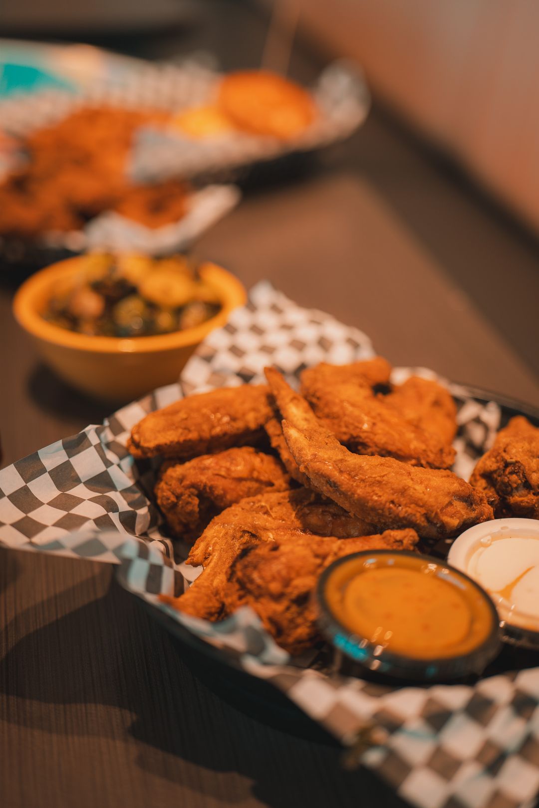 A basket of Sal's Birdland jumbo wings with Sassy Sauce for dipping